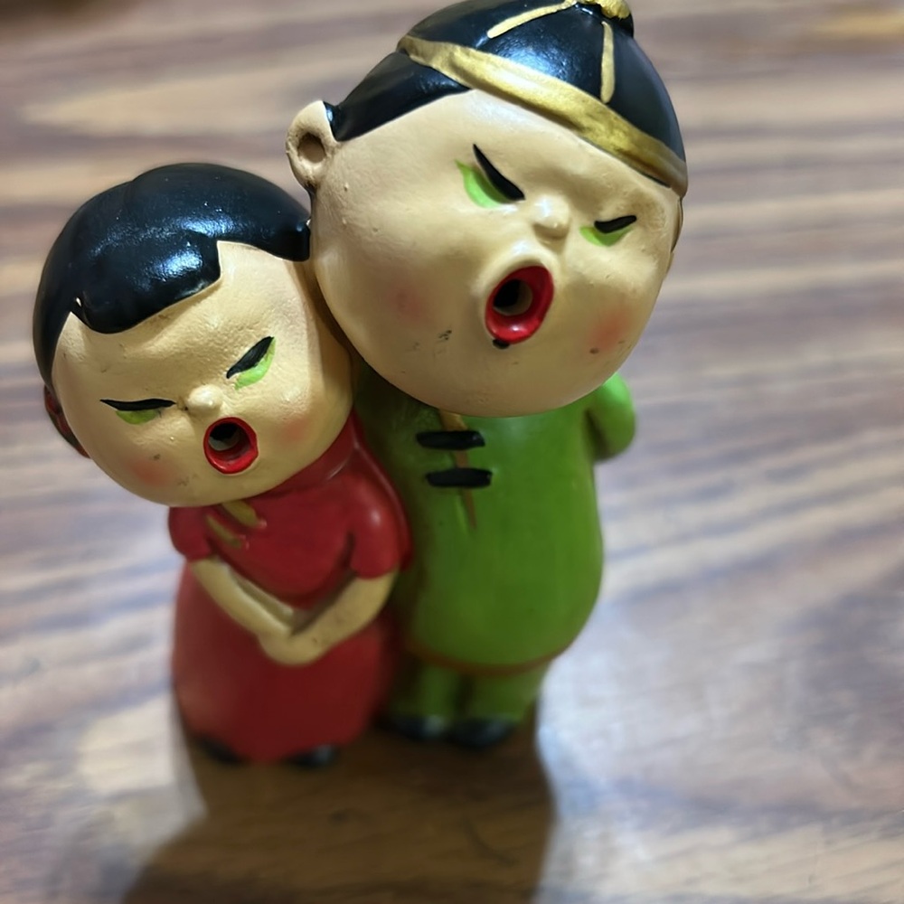 Vintage hand painted Asian boy and girl singing.